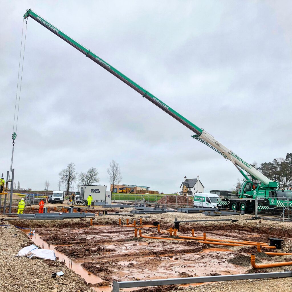 Crane laying foundations